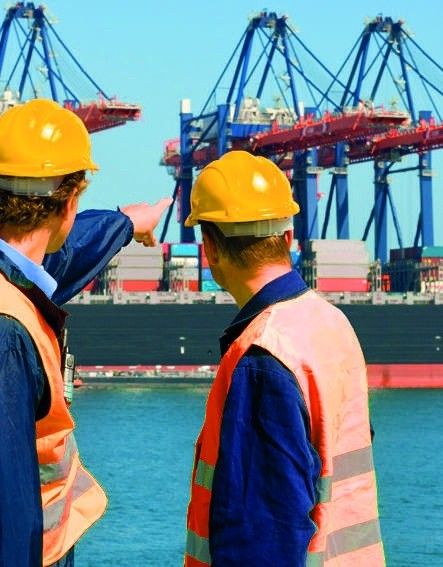 NV Ship Agency staff on the quay reviewing container operations